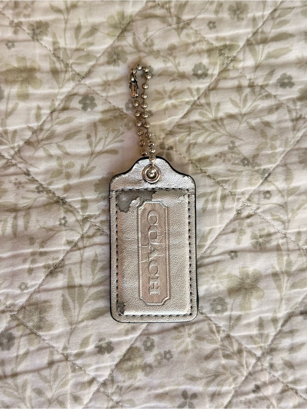 Coach silver metallic hang tag